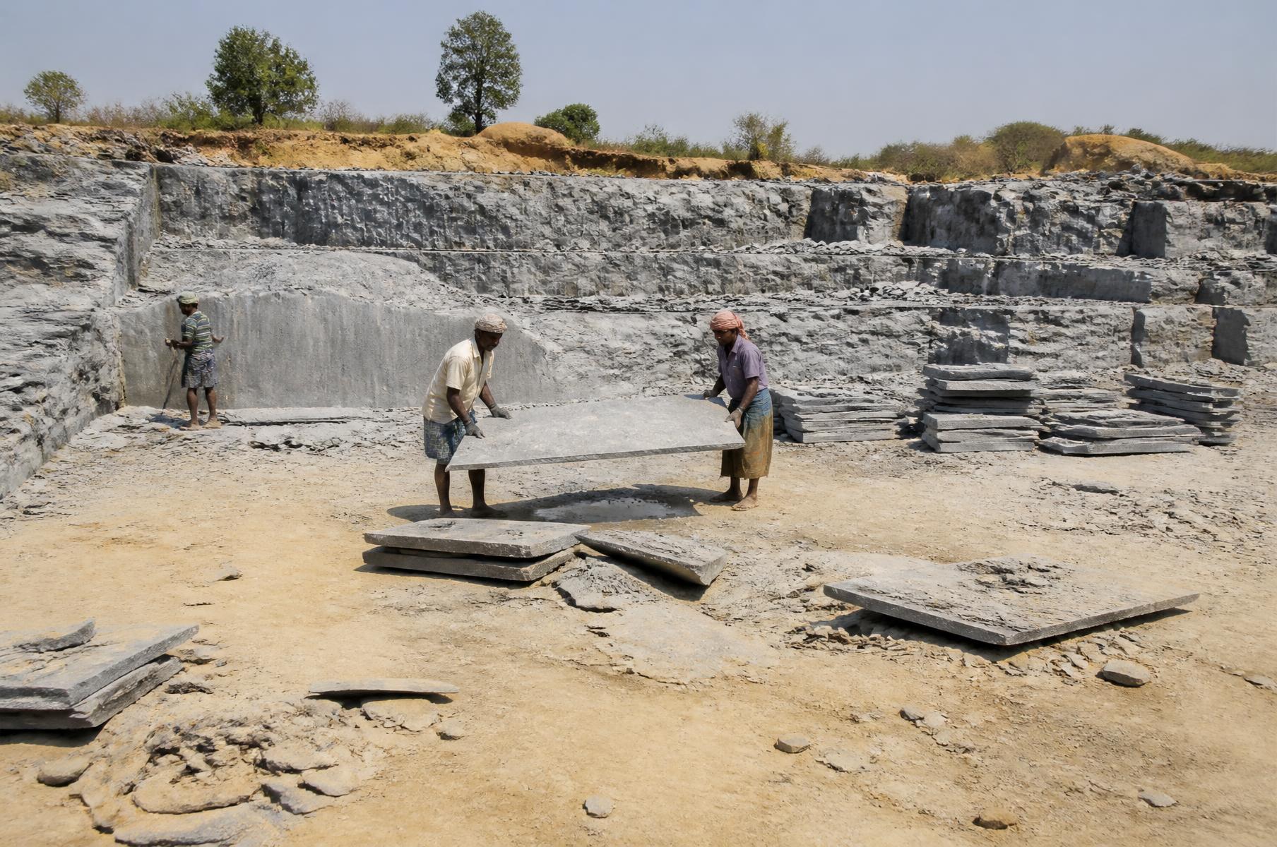 Quarry working face at Miriyan with flat horizontal limestone beds being lifted as large thin sheets